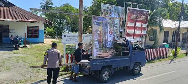 Imbau Stop Miras, Bhabinkamtibmas bersama Perangkat Desa pasang Spanduk Imbauan